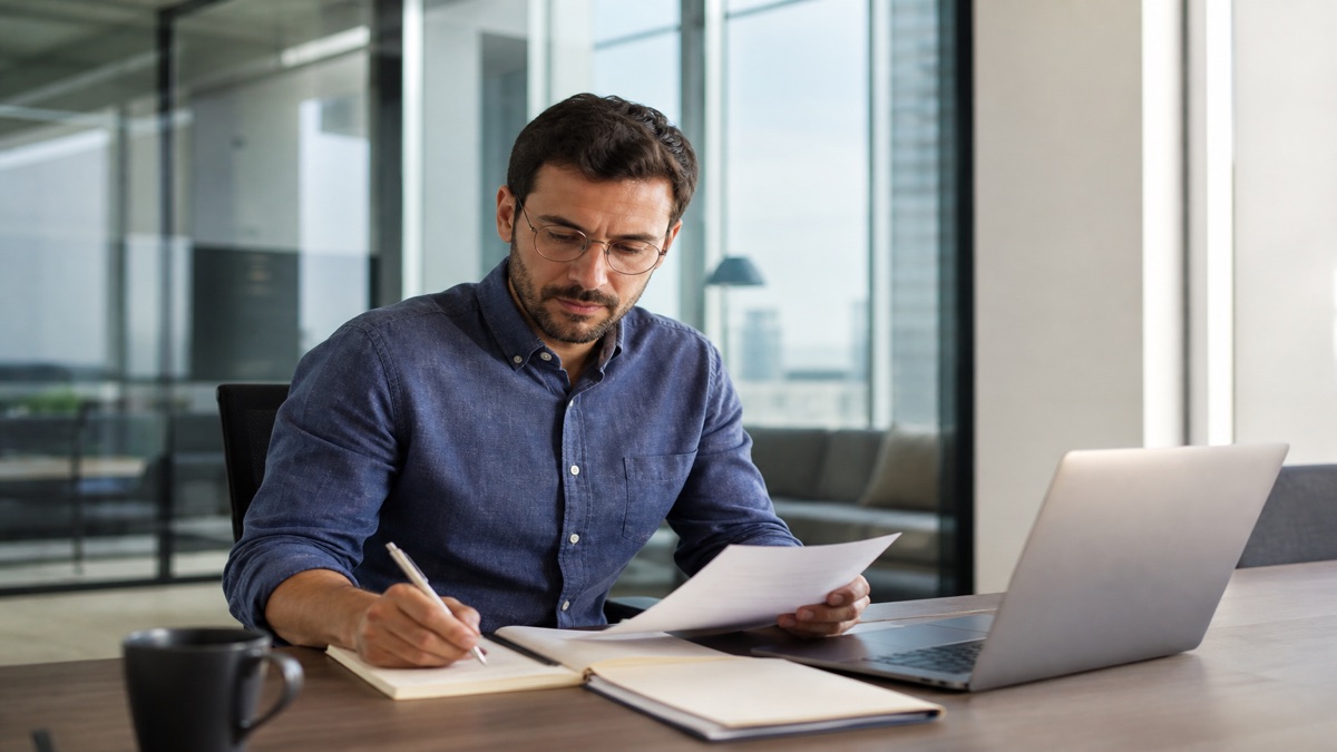 Professional preparing notes before a performance review